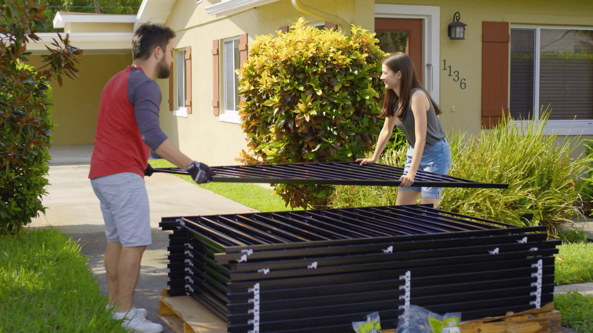 DIY aluminum Fence in a Box installation with black fence panels