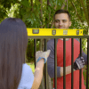 Aluminum Fence in a Box gate installation with level tool