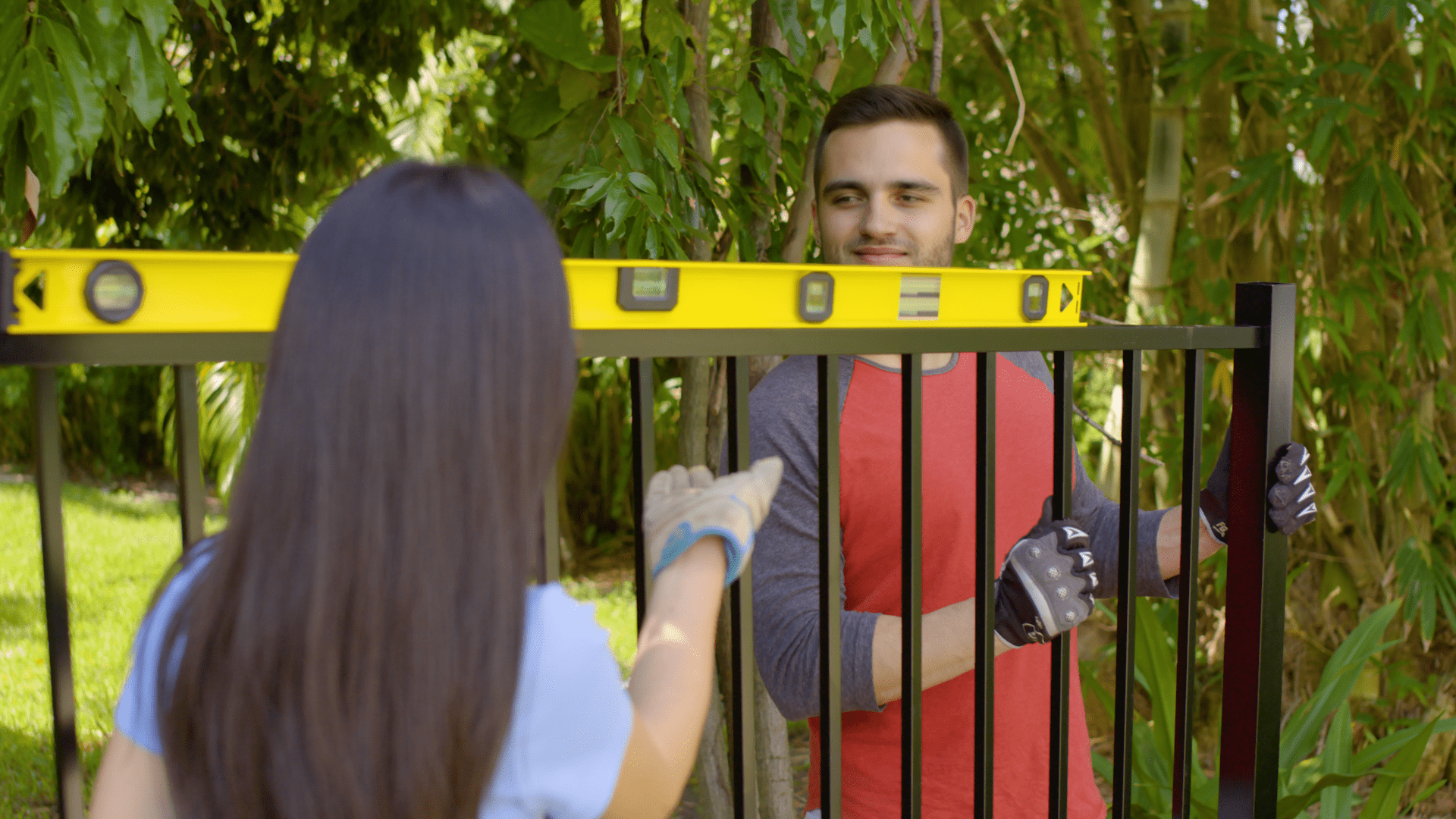 Aluminum Fence in a Box gate installation with level tool