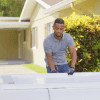 DIY vinyl Fence in a Box installation with white fence panels