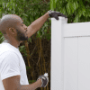 Vinyl Fence in a Box panel being installed in backyard